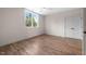 Bright bedroom with hardwood floors, ceiling fan, and natural light from the window at 250 Pilot Ridge Rd, Zebulon, NC 27597