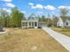 Beautiful two-story home with a covered porch, a screened porch, and an attached two-car garage at 250 Pilot Ridge Rd, Zebulon, NC 27597
