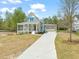 Beautiful two-story home with a covered porch, a screened porch, and an attached two-car garage at 250 Pilot Ridge Rd, Zebulon, NC 27597