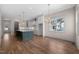 Modern kitchen with a spacious island, white cabinetry, and stainless steel appliances at 250 Pilot Ridge Rd, Zebulon, NC 27597