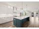 Bright, open kitchen with a large island, stainless appliances, and hardwood floors at 250 Pilot Ridge Rd, Zebulon, NC 27597