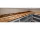 Pantry with wooden countertop, open shelving, and ample storage space at 250 Pilot Ridge Rd, Zebulon, NC 27597