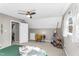 This bedroom features a dormered ceiling, window, and a door into another room at 2700 Ross Rd, Durham, NC 27703