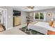 This well lit bedroom features a large window and a mounted flat screen television at 2700 Ross Rd, Durham, NC 27703
