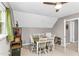 This room with a dormered ceiling provides a variety of uses with a table at 2700 Ross Rd, Durham, NC 27703