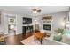 Comfortable living room with a fireplace, hardwood floors, and a cozy sectional sofa at 2700 Ross Rd, Durham, NC 27703