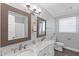 Bright bathroom features double sinks, marble countertops, and modern fixtures at 283 Raynor Rd, Spring Lake, NC 28390