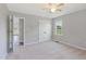 Large bright bedroom with neutral walls, carpet, large windows, and a ceiling fan at 283 Raynor Rd, Spring Lake, NC 28390
