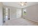Relaxing bedroom with neutral paint, carpeted floor, ceiling fan, and large closet for storage at 283 Raynor Rd, Spring Lake, NC 28390