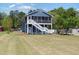 Charming two-story home with a screened-in porch and well-maintained lawn at 283 Raynor Rd, Spring Lake, NC 28390