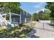 Two-story home with a two-car garage, fenced-in backyard, and lawn at 283 Raynor Rd, Spring Lake, NC 28390