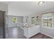 Bright kitchen features an island with butcher block countertop, wood floors, and neutral paint at 283 Raynor Rd, Spring Lake, NC 28390