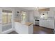 Beautiful kitchen includes wood floors, white cabinets, stainless steel appliances, and butcher block countertop island at 283 Raynor Rd, Spring Lake, NC 28390