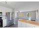 Open kitchen with stainless steel appliances, wood flooring, and an island with butcher block countertop at 283 Raynor Rd, Spring Lake, NC 28390