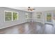 Sun-filled living room with wood floors, neutral paint, and large windows offering a green view at 283 Raynor Rd, Spring Lake, NC 28390