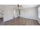 Open living space with wood floors, neutral paint, and an open floor plan leading to the kitchen at 283 Raynor Rd, Spring Lake, NC 28390