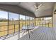 Relax on this screened-in porch with a ceiling fan and private outdoor views at 283 Raynor Rd, Spring Lake, NC 28390