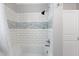 Updated shower features white subway tile with decorative glass accents at 283 Raynor Rd, Spring Lake, NC 28390