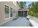 Spacious back deck with outdoor seating, perfect for enjoying the surrounding lush greenery at 3 Haycox Ct, Durham, NC 27713