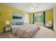 Inviting bedroom with bright yellow walls, a plush bed, and large window with natural light at 3 Haycox Ct, Durham, NC 27713