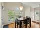 Bright breakfast nook with a view of the backyard, featuring a table and chairs at 3 Haycox Ct, Durham, NC 27713