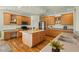 Spacious kitchen features hardwood floors, an island with sink, and stainless steel appliances at 3 Haycox Ct, Durham, NC 27713