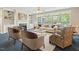 Comfortable living room with built-in shelving, fireplace, and large windows overlooking the backyard at 3 Haycox Ct, Durham, NC 27713