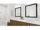 Elegant bathroom with dual vanities, sleek mirrors, modern lighting, and a glass-enclosed shower at 3020 White Rail Dr, Fuquay Varina, NC 27526