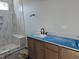 Bathroom features a tiled shower with bench, and a vanity with cabinets at 3020 White Rail Dr, Fuquay Varina, NC 27526