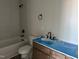 Bathroom featuring a vanity with cabinets, tub and shower with black fixtures at 3020 White Rail Dr, Fuquay Varina, NC 27526