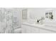 Bright bathroom featuring double sinks, a white vanity, a shower-tub combo, and fresh neutral decor at 3020 White Rail Dr, Fuquay Varina, NC 27526