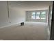 Spacious bonus room featuring three windows that provide plenty of natural light at 3020 White Rail Dr, Fuquay Varina, NC 27526
