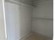 Walk in closet with wooden shelving and white walls at 3020 White Rail Dr, Fuquay Varina, NC 27526