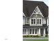 Attractive townhome exterior with multiple gables, complemented by white trim and stone accents at 3020 White Rail Dr, Fuquay Varina, NC 27526