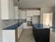 New kitchen featuring white cabinets, stainless steel appliances, and a center island with a black base at 3020 White Rail Dr, Fuquay Varina, NC 27526