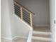 A staircase with wooden banisters and black metal supports at 3020 White Rail Dr, Fuquay Varina, NC 27526