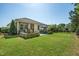 Spacious backyard with a patio, dining set, and well-maintained lawn at 3029 Willow Ranch Dr, Fuquay Varina, NC 27526