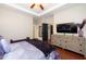 Bright bedroom with a plush bed, dresser, and ample closet space at 3029 Willow Ranch Dr, Fuquay Varina, NC 27526