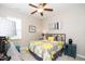 Bedroom with a queen-size bed, bright bedding, and a ceiling fan at 3029 Willow Ranch Dr, Fuquay Varina, NC 27526