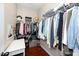 Walk-in closet with shelving, hanging space, and a cozy corner for seating at 3029 Willow Ranch Dr, Fuquay Varina, NC 27526