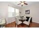 Cozy dining room with a round glass table, seating for four, and light-colored chairs at 3029 Willow Ranch Dr, Fuquay Varina, NC 27526
