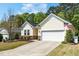 Charming single Gathering home with manicured lawn, 2-car garage, and tasteful landscaping at 3029 Willow Ranch Dr, Fuquay Varina, NC 27526