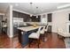 Spacious kitchen with a large island, stainless steel appliances, and modern pendant lighting at 3029 Willow Ranch Dr, Fuquay Varina, NC 27526