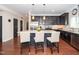 Open-concept kitchen featuring a large island with seating, stainless appliances and ample counter space at 3029 Willow Ranch Dr, Fuquay Varina, NC 27526