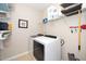 Well-equipped laundry room with modern appliances and ample storage shelves at 3029 Willow Ranch Dr, Fuquay Varina, NC 27526