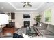 Bright living room with hardwood floors, fireplace and open kitchen view at 3029 Willow Ranch Dr, Fuquay Varina, NC 27526