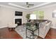 Comfortable living room with a fireplace, plush seating, and an abundance of natural light at 3029 Willow Ranch Dr, Fuquay Varina, NC 27526
