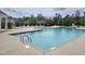 Community pool with lounge chairs and fenced perimeter creating a recreational space for residents at 3029 Willow Ranch Dr, Fuquay Varina, NC 27526