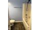 Bathroom featuring a standard toilet, towel bar, and a bathtub with a shower curtain and tiled flooring at 303 Smith Level Rd # E32, Chapel Hill, NC 27516