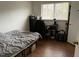 Neutral bedroom with a bed, a window, and a desk at 303 Smith Level Rd # E32, Chapel Hill, NC 27516